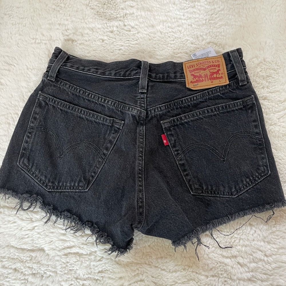 Levi high waisted button up black denim shorts